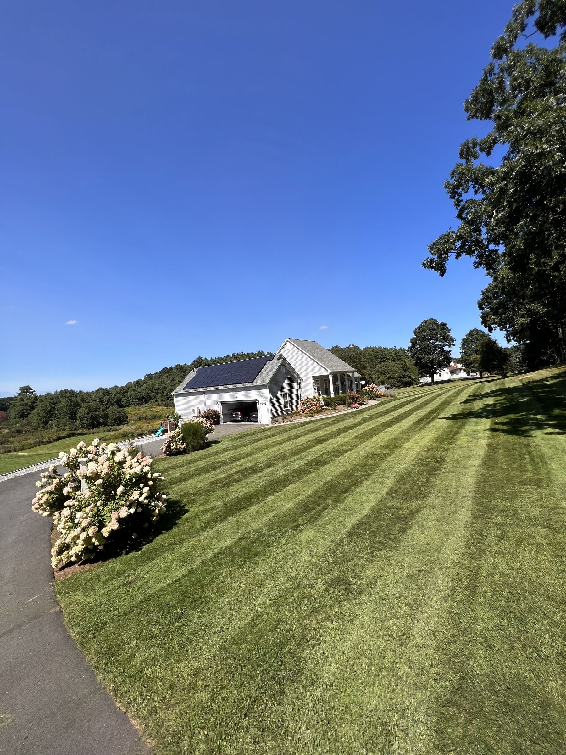 Large property with striped lawn